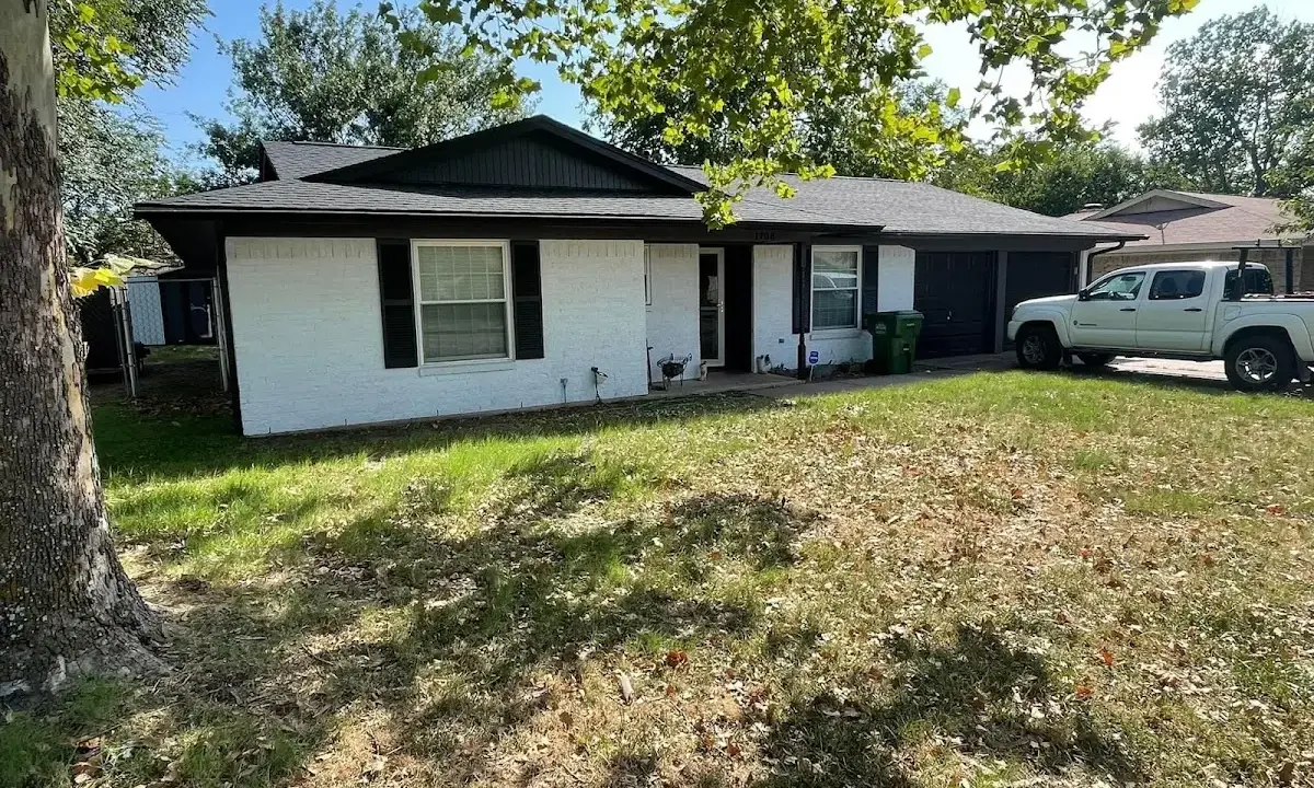 Professional roofing crew working on a residential roof in Mountlake Terrace